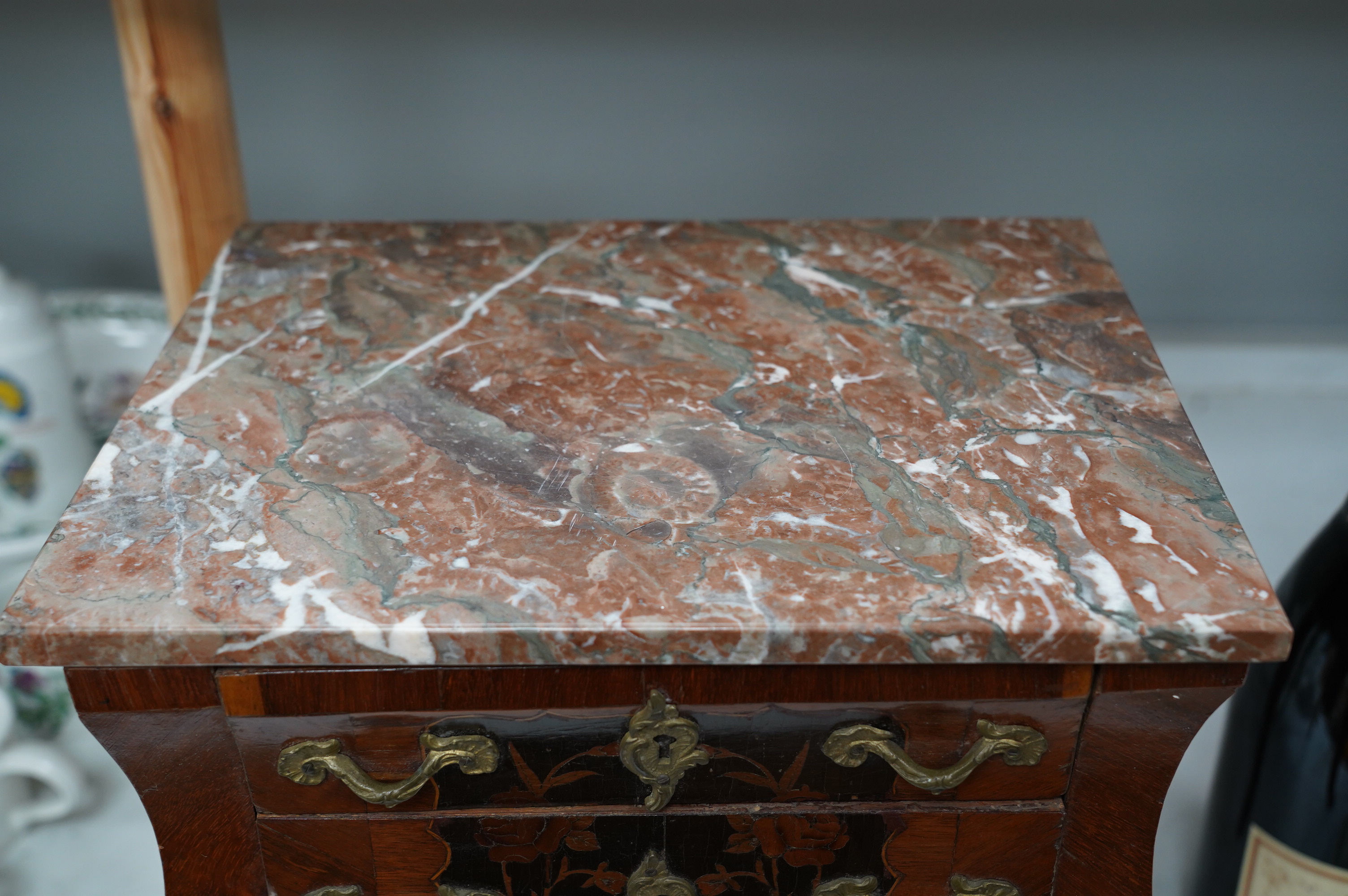 A 19th century French miniature kingwood and marquetry chest, marble topped, 35.5cm high. Condition - fair, some minor damage and losses to veneer etc.